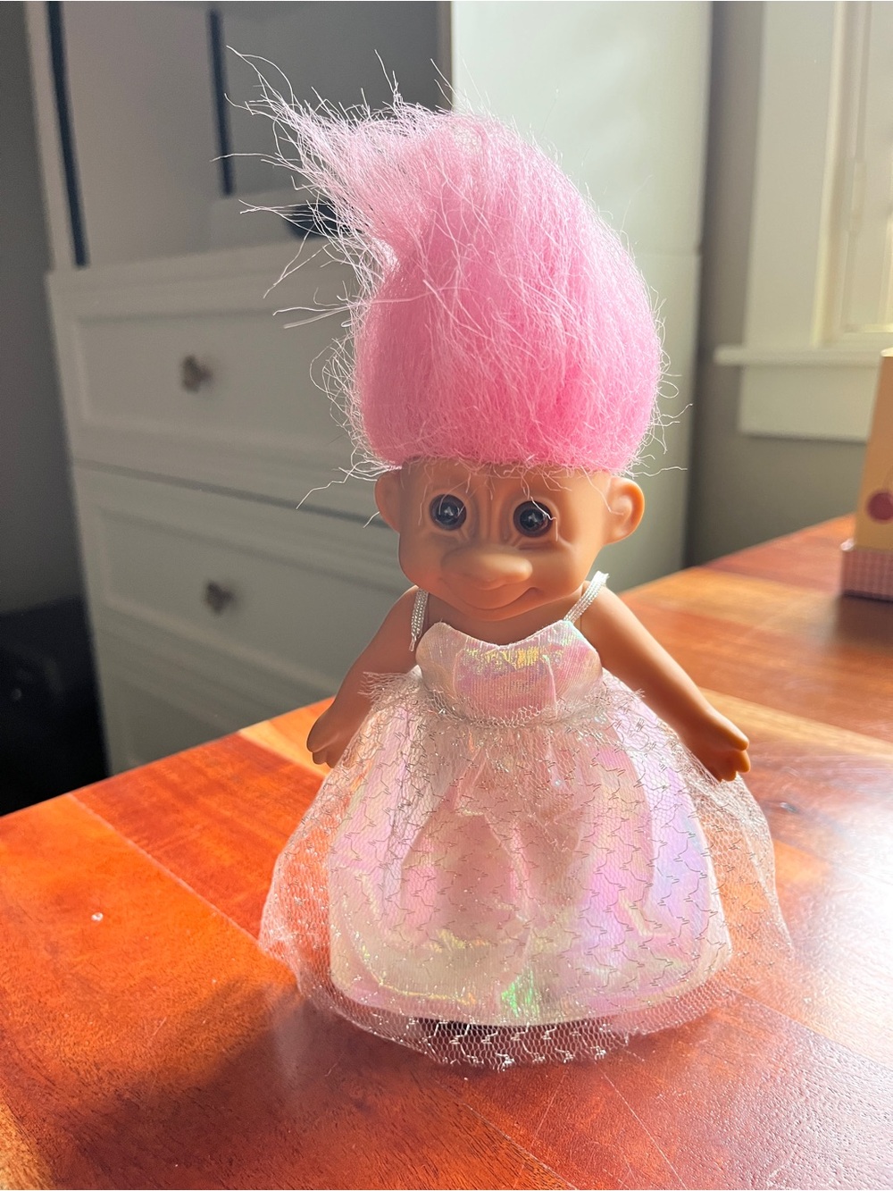 Russ Berrie troll doll featuring Soft Pink hair.The doll wears a dress